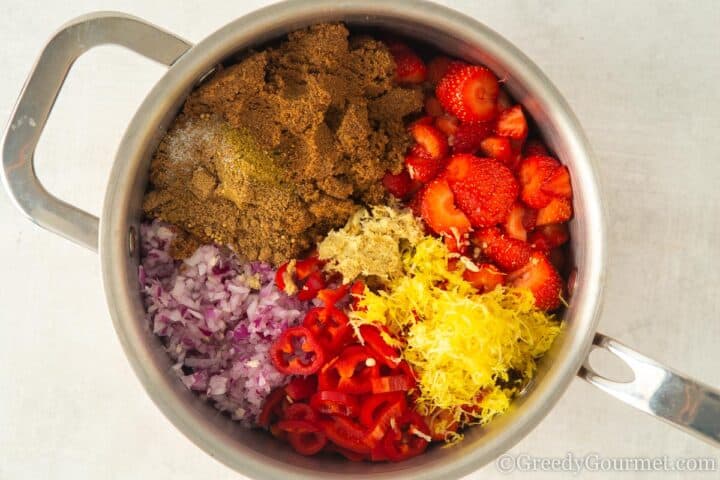 ingredients in a pot for strawberry chutney.