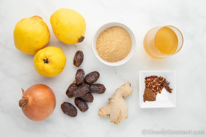 ingredients for quince chutney laid on a table.