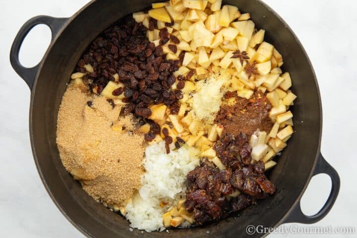 ingredients for quince chutney in a cooking pot.