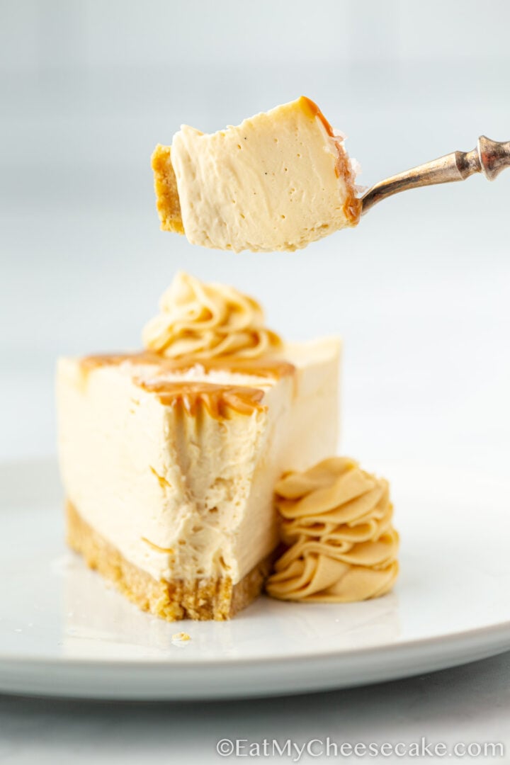 Slice cut out from no bake salted caramel cheesecake.