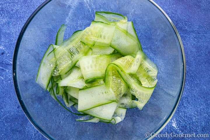 Shaved cucumber slices in bowl