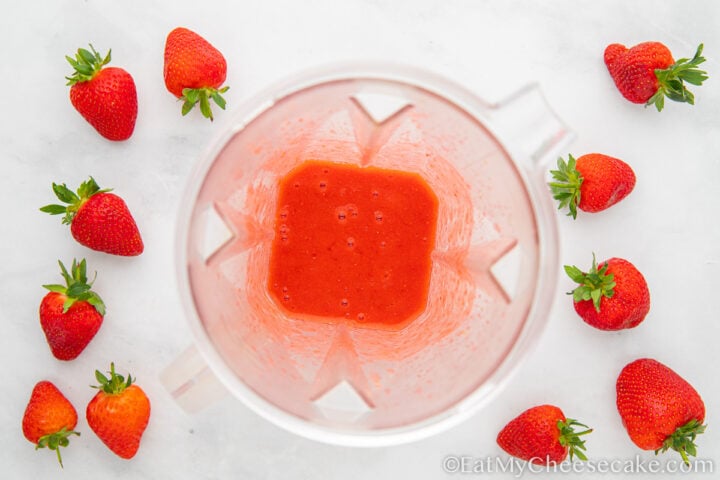 Blended strawberries in a blender.