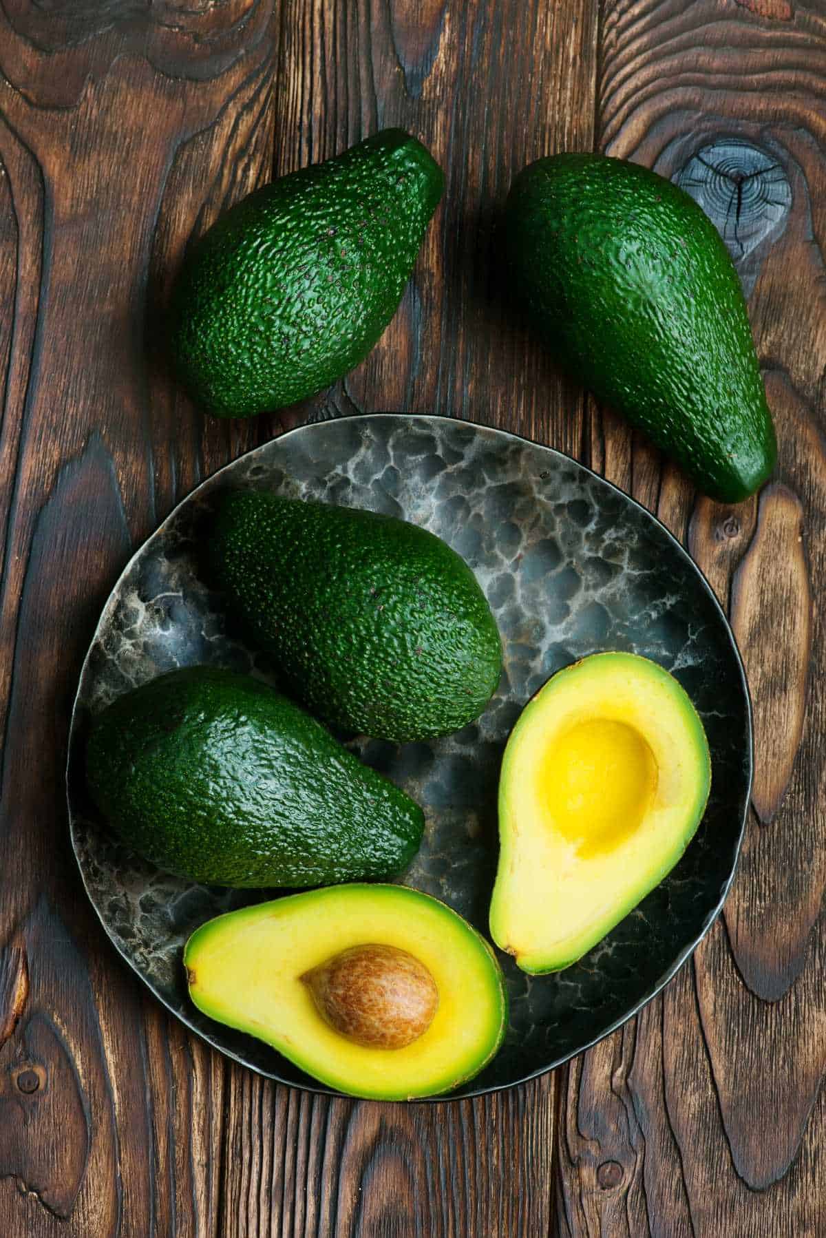 avocado halves in a bowl.