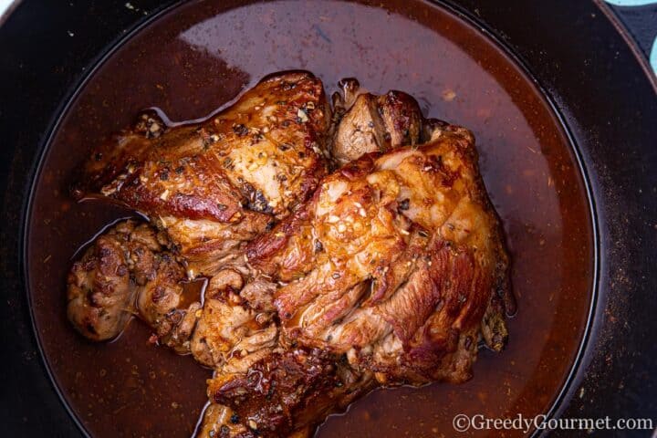 Sauteéd lamb sitting in adobo sauce