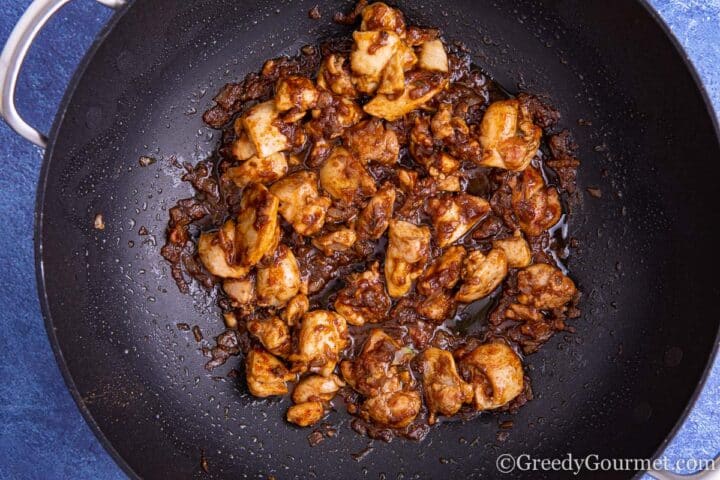 Saucepan with chicken, spices and chilli