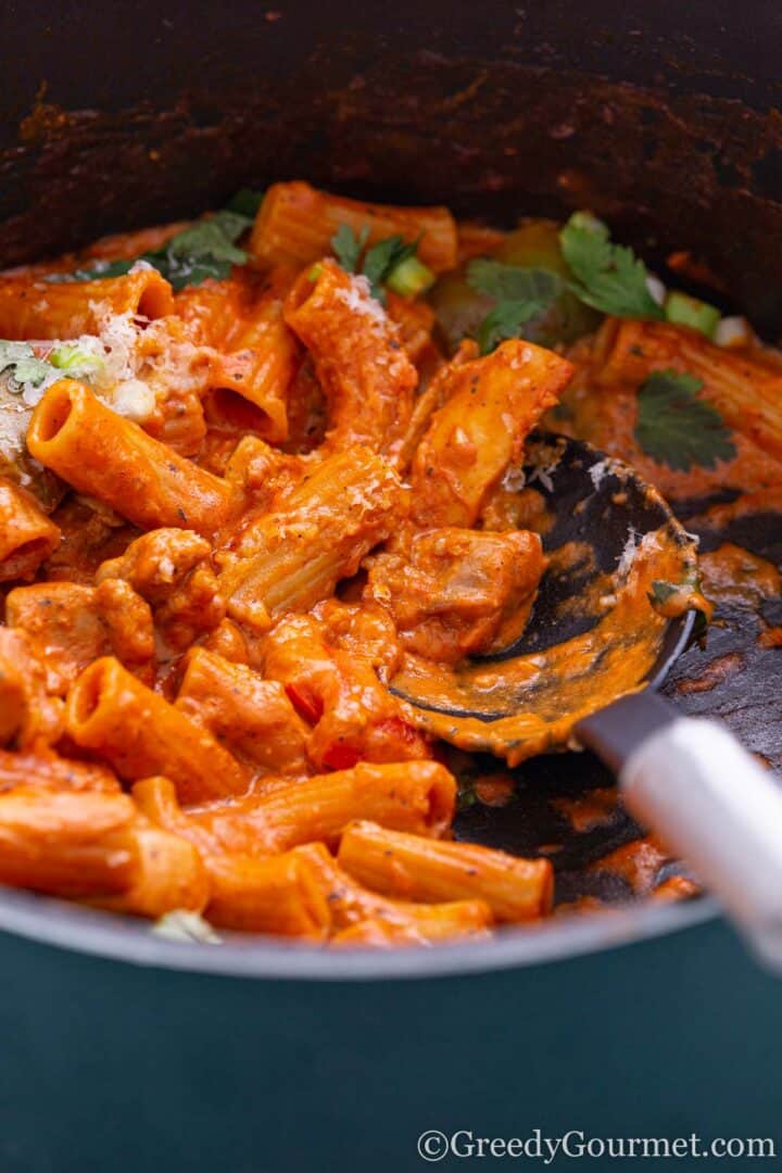 Plate of cajun chicken pasta half eaten