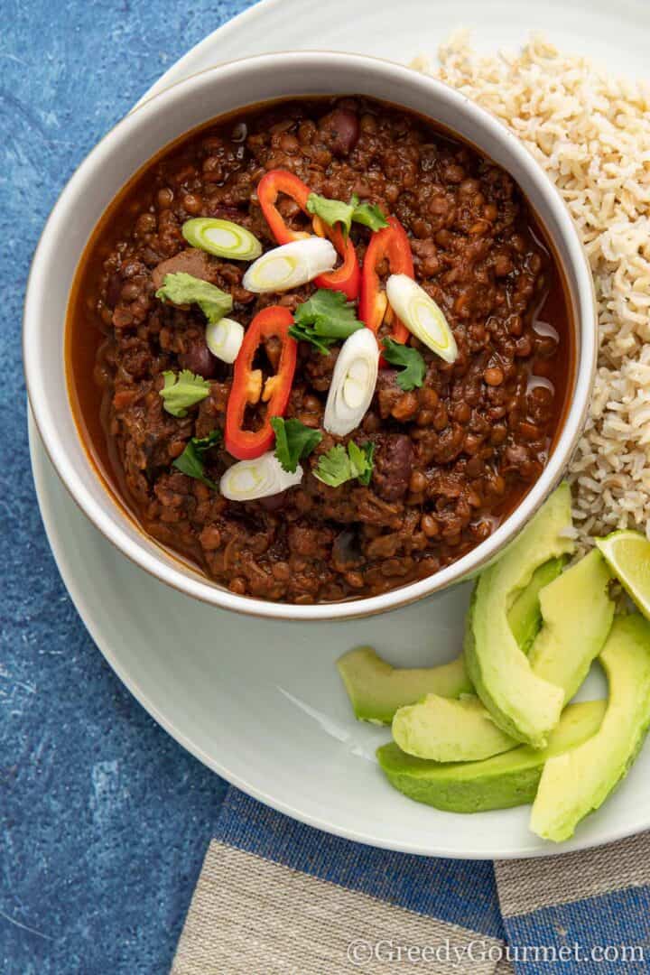 Burnt Aubergine Chilli with rice and avocado slices