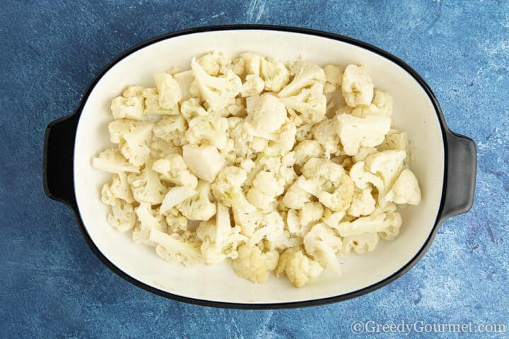 cooked cauliflower in a baking dish.