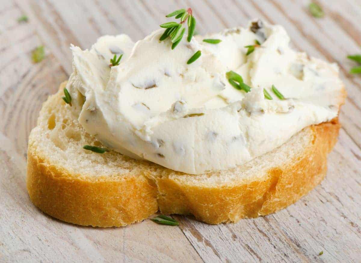 cream cheese mixed with herbs on bread