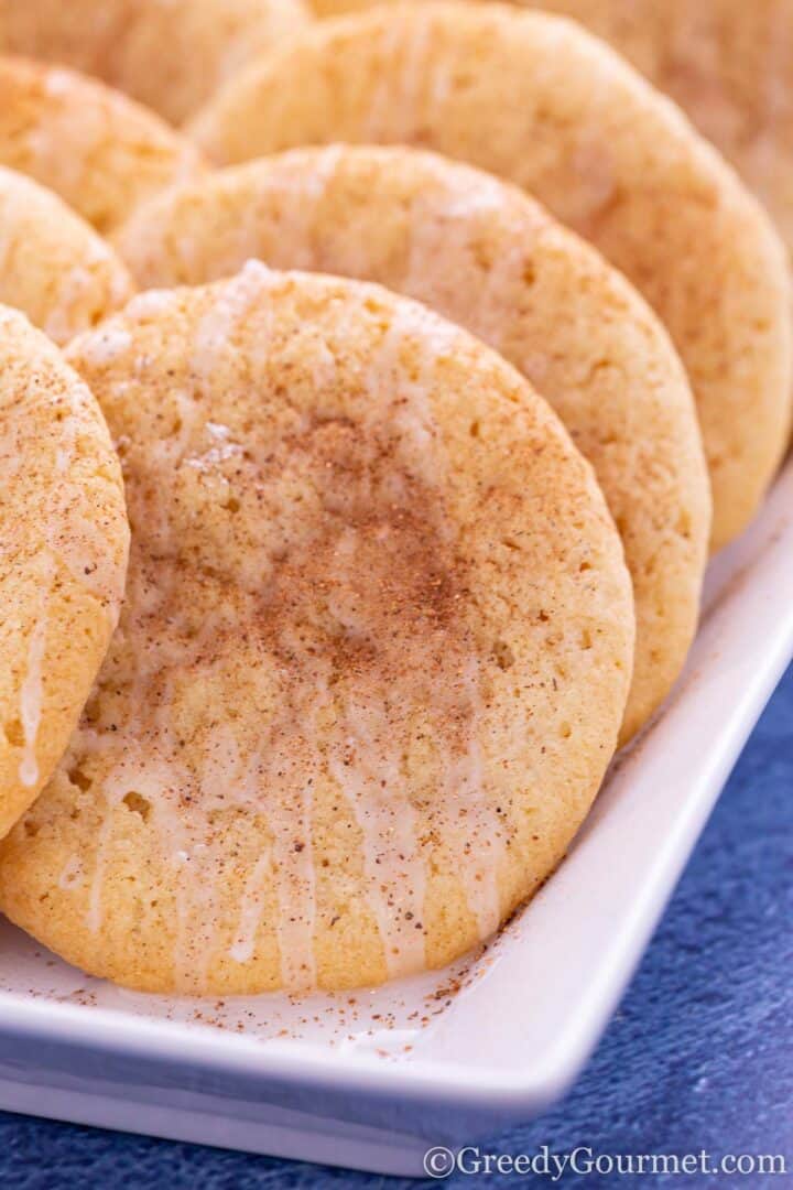 closeup of baked eggnog cookies on a plate.