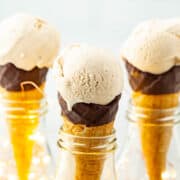 Three scoops of eggnog ice cream in cones