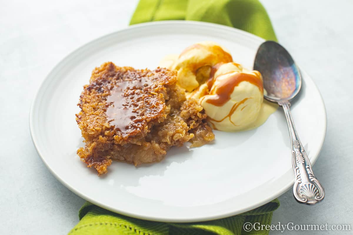 Slice of apple pudding on a plate for a Thanksgiving desserts.
