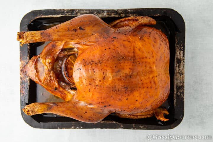 cooked turkey in black pan