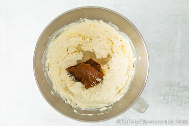 adding caramel to cream cheese filling.