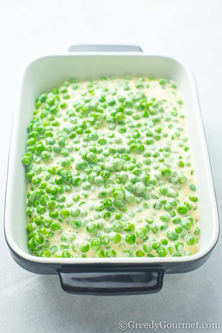 Dish of cheesy peas
