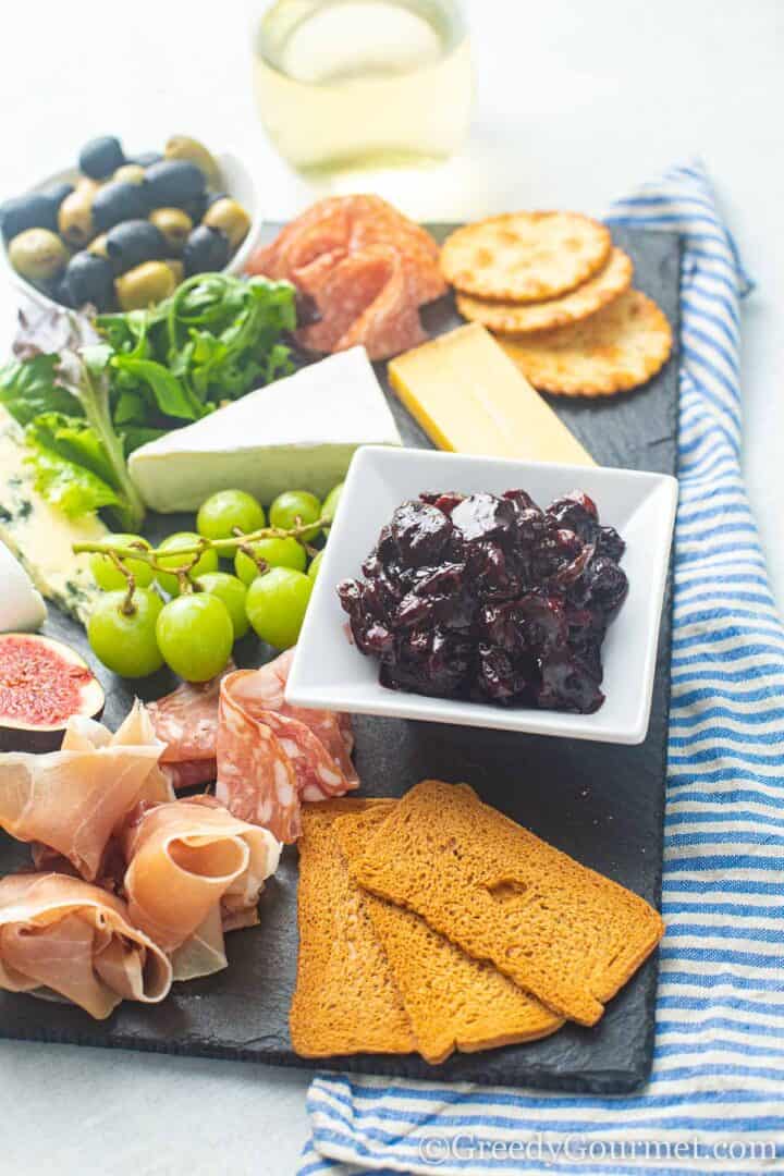 charcuterie board with cherry chutney