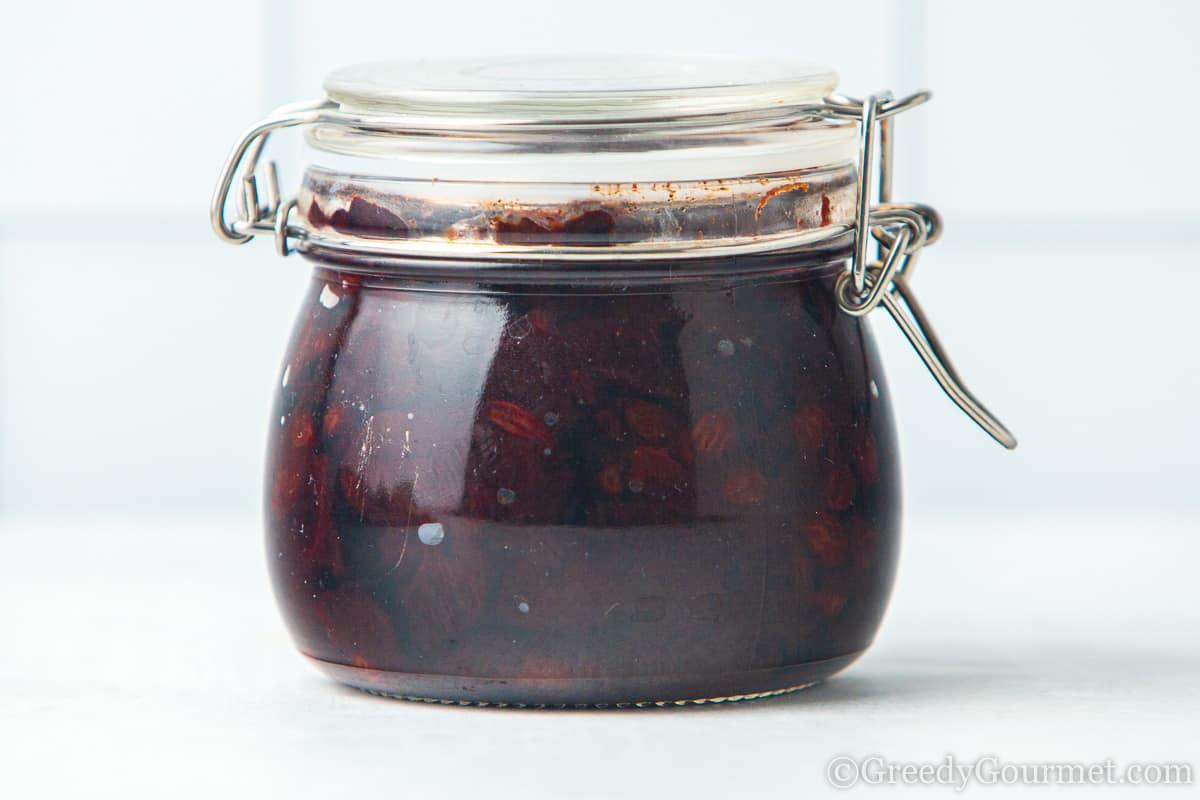 cherry chutney in a glass jar.
