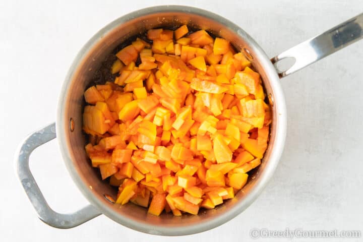 chopped papaya in a cooking pot