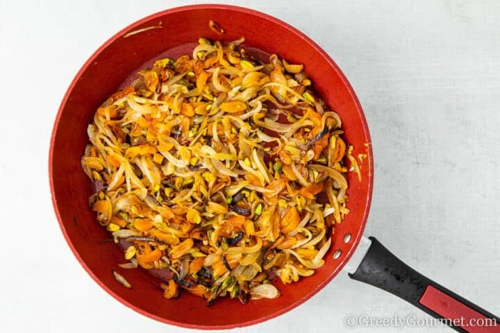 Large frying pan full of apricot stuffing