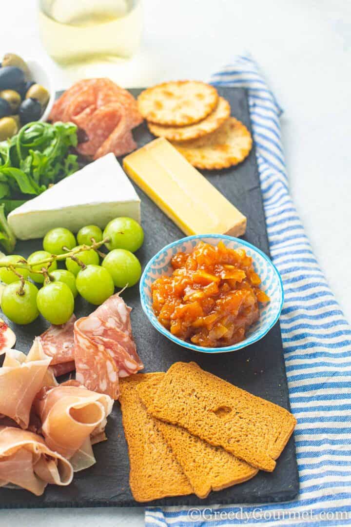 charcuterie board with papaya chutney