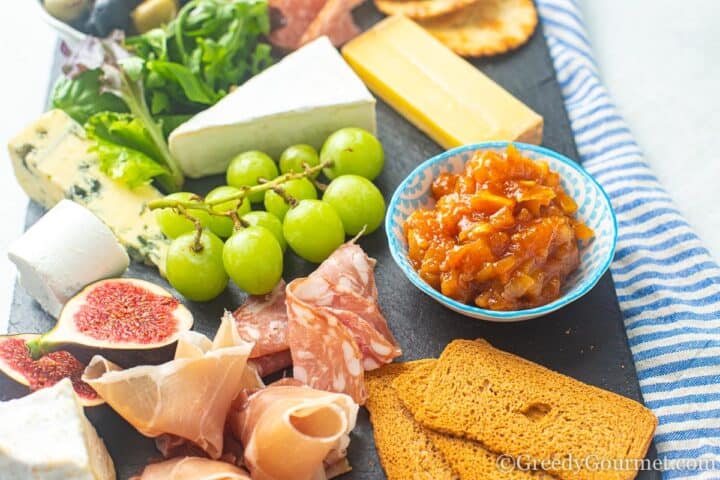 charcuterie board with papaya chutney