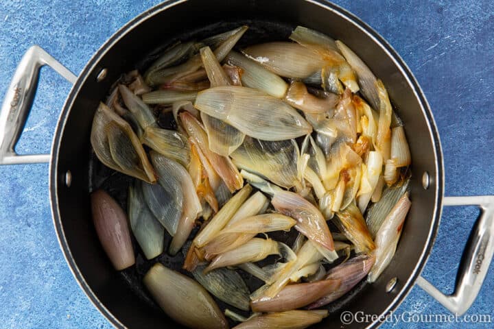 caramelised shallots in a cooking pot.