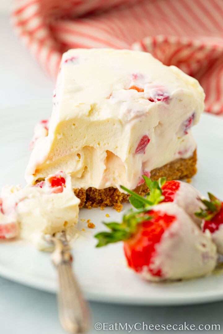 slice of strawberry and white chocolate cheesecake.