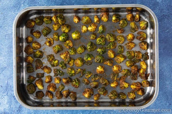roasted brussels sprouts chips on a baking tray.