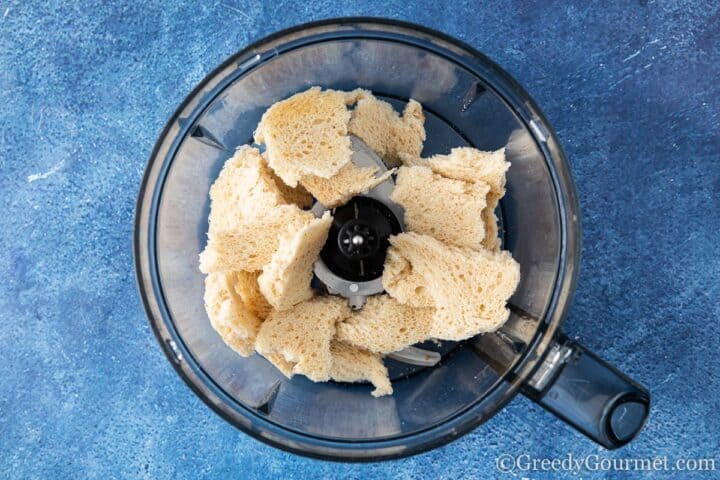 white bread pieces in a blender.