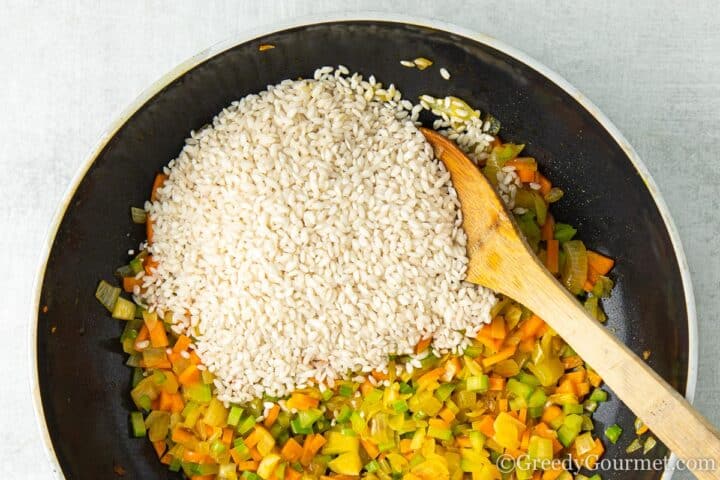 add rice to fried vegetables.