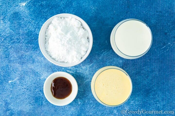 ingredients needed for eggnog ice cream laid out on a table