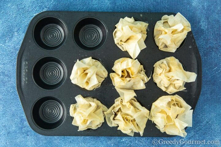 Filo pastry cases ready to go in the oven.