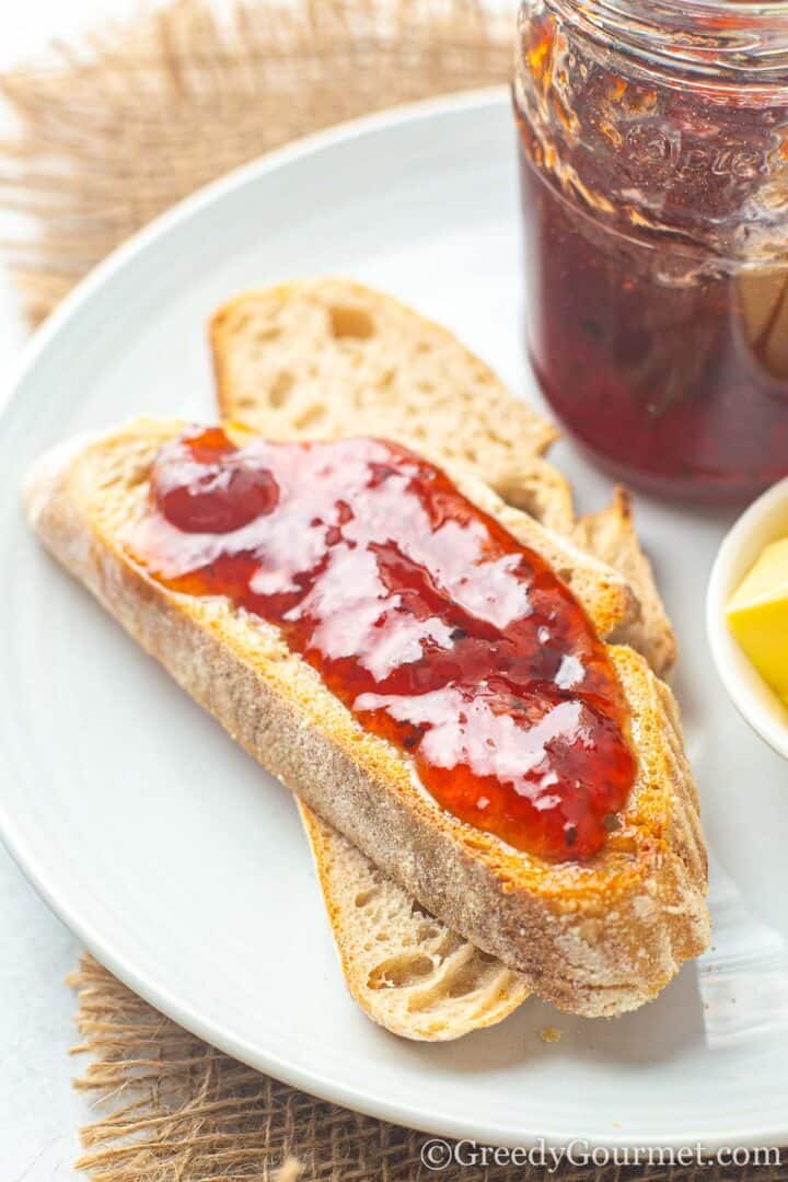 Gooseberry jam on bread slices.