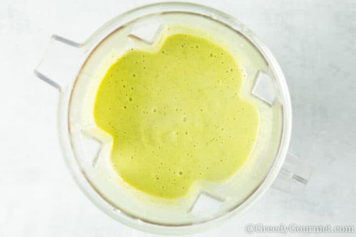 green soup in blender.