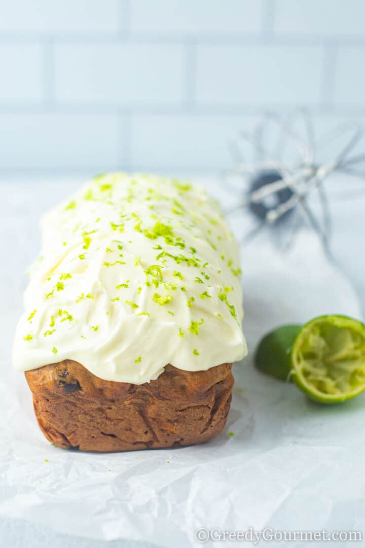 Marrow cake topped with lime icing and lime zest.