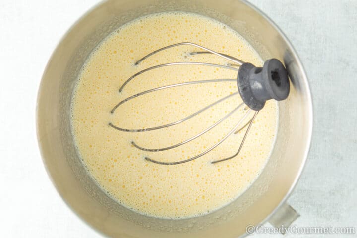 Whisking the batter for marrow cake.