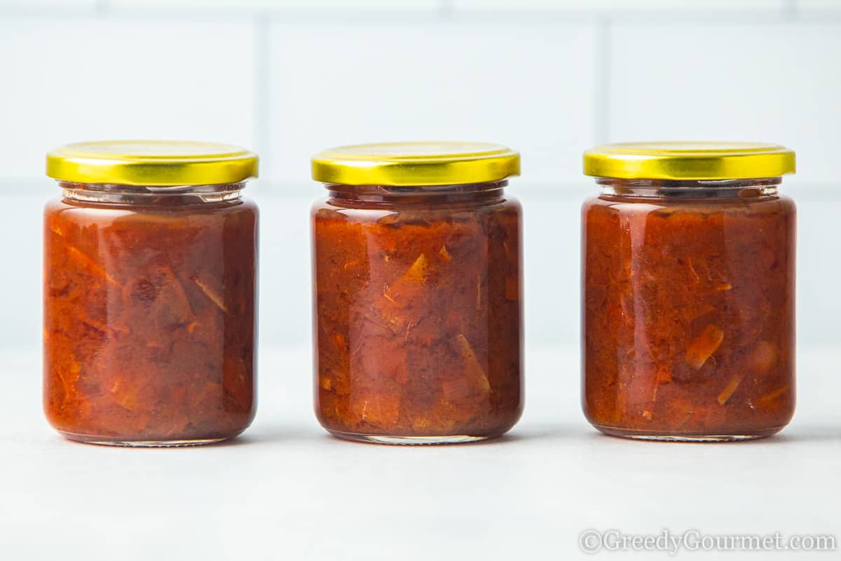 Jars of orange chutney.