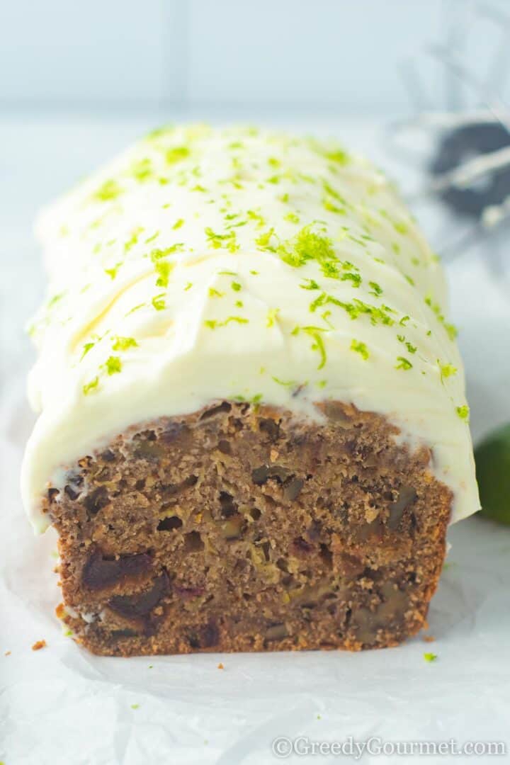 Marrow cake with lime icing and lime zest.