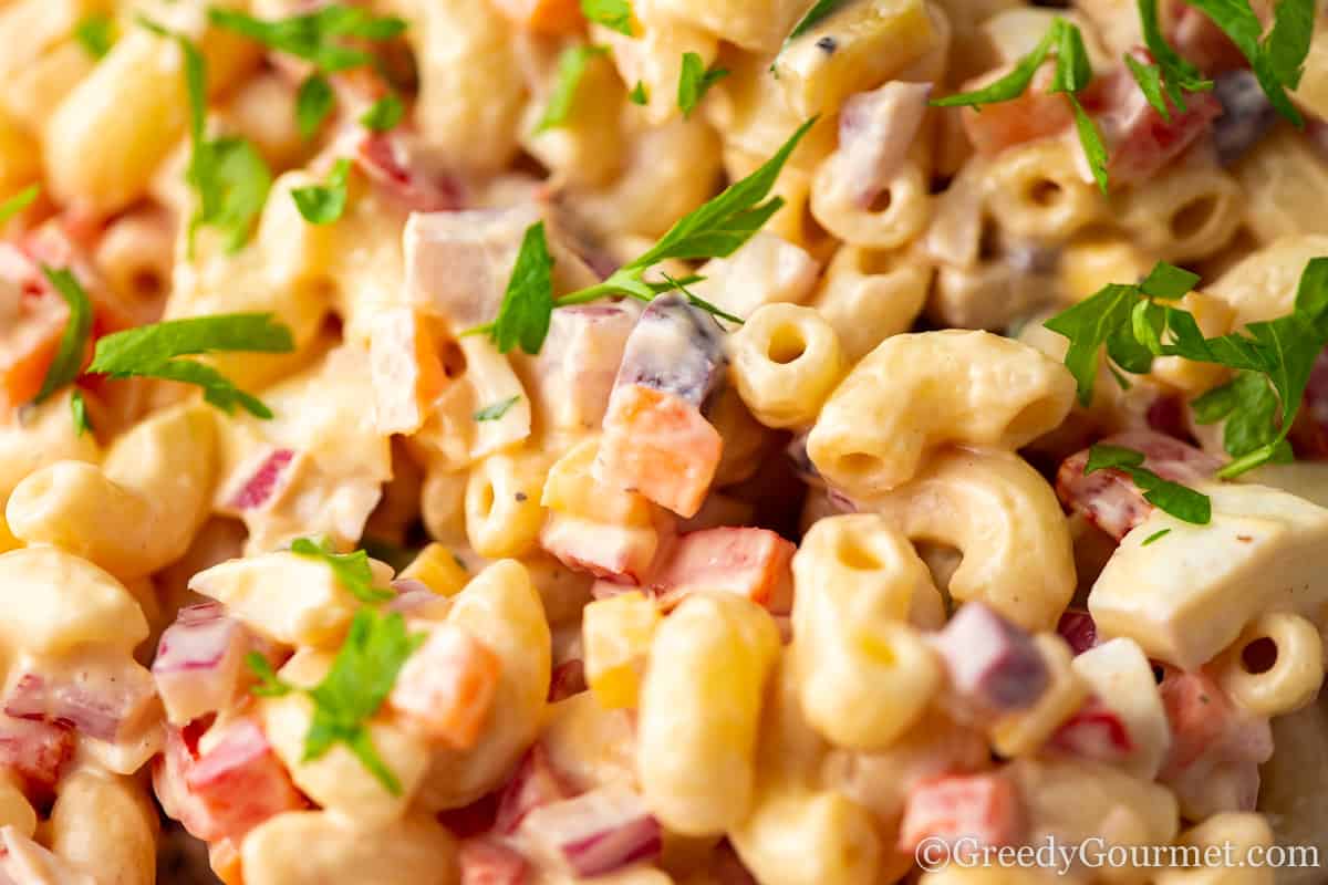 macaroni salad close up garnished with herbs