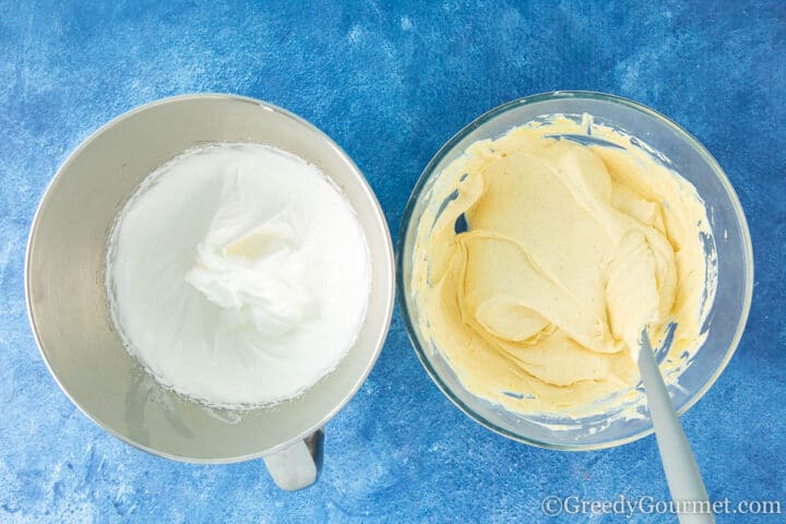 Folding whipped egg whites with eggnog pate and whipped cream mix.