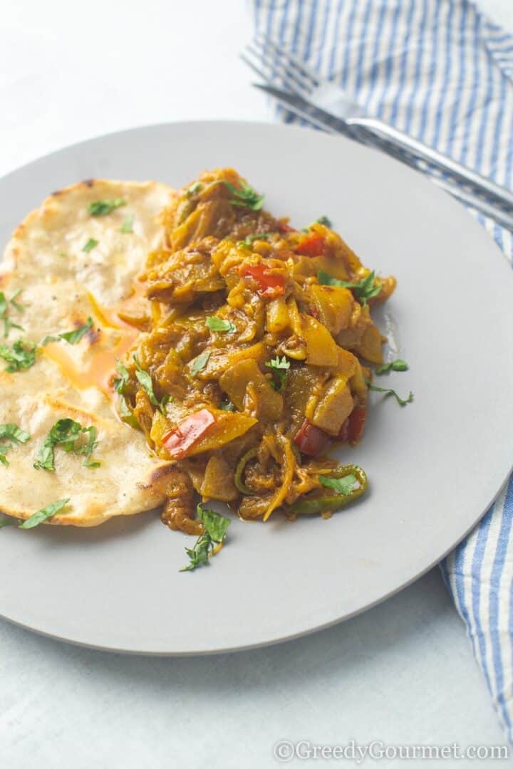 marrow curry with roti on a plate