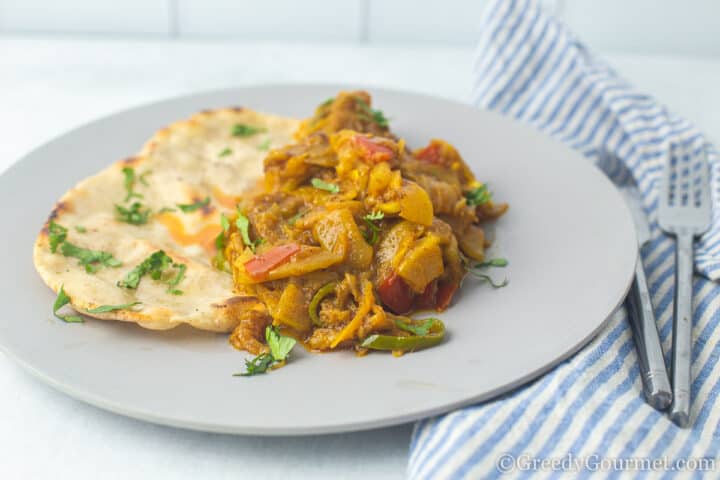 marrow curry and roti on a plate