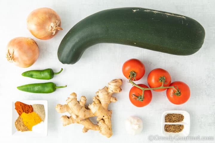raw ingredients for marrow curry on a table