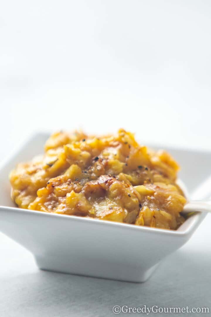 Sautéed marrow seeds in a square white serving dish.