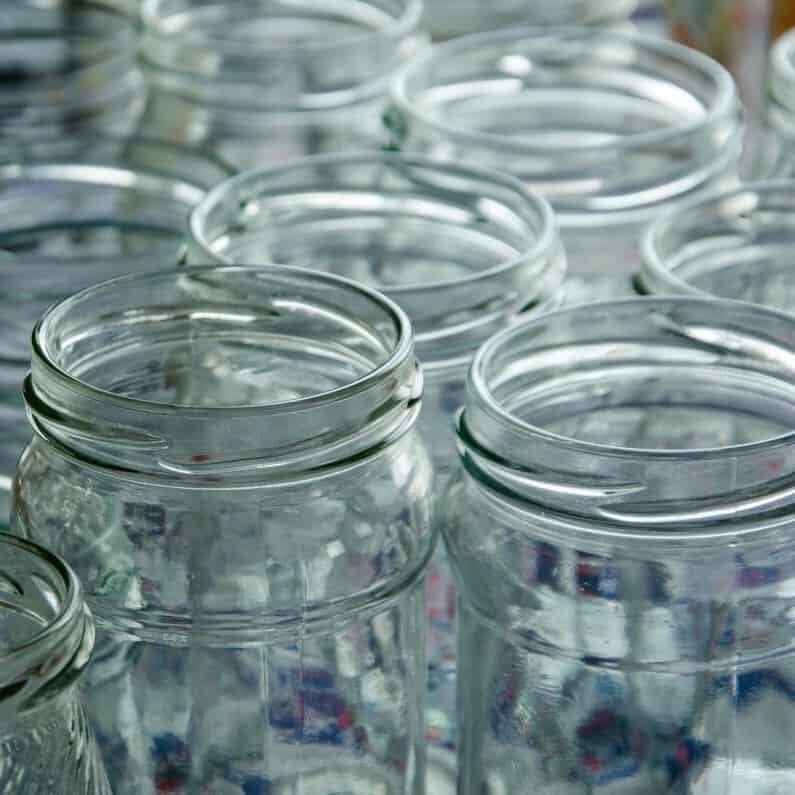 Glass jars ready to be sterilized.