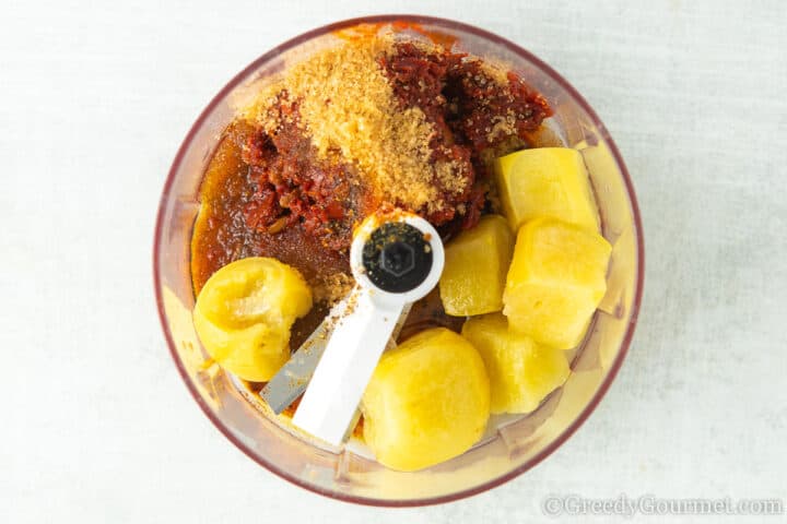 Combining ingredients for a harissa marinade.