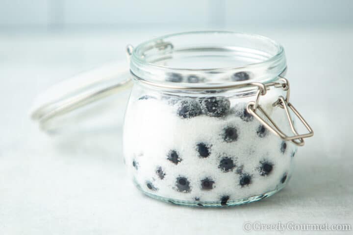 sloe berries in sugar.