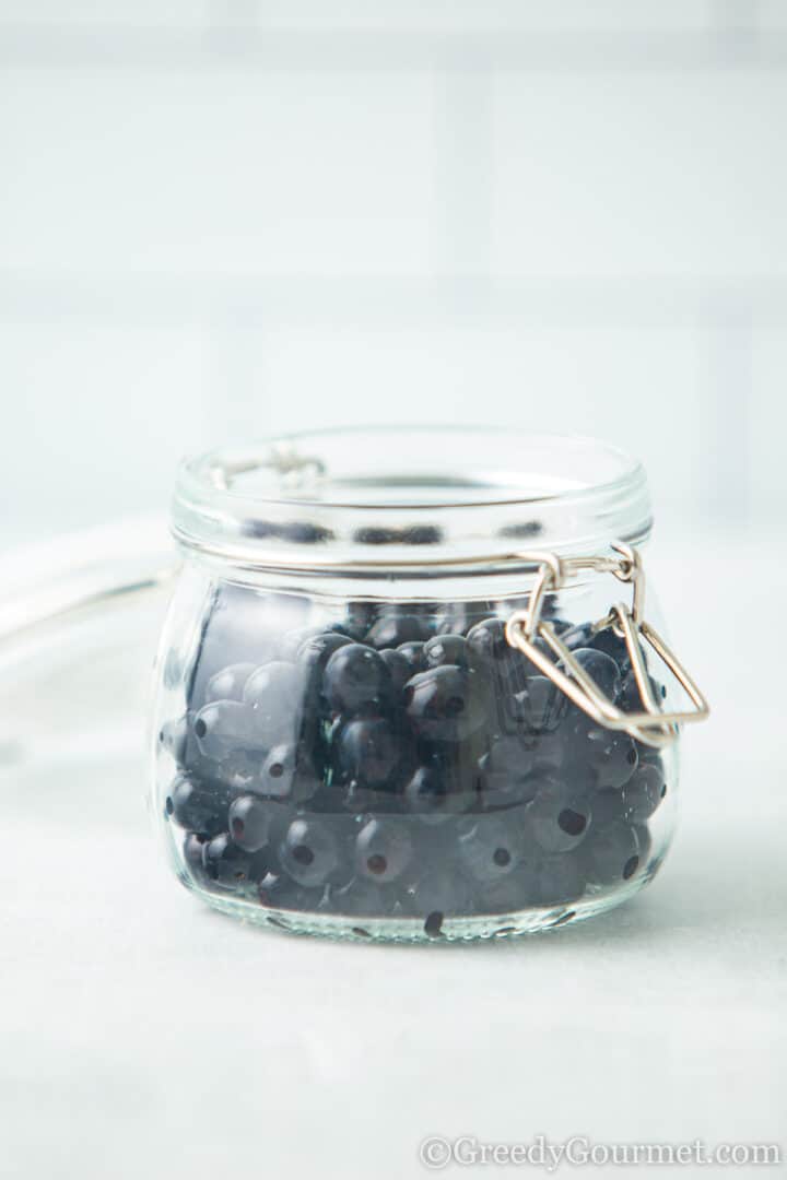 sloe berries in a jar