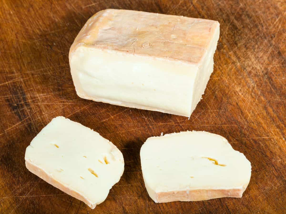 slices from a block of taleggio cheese.