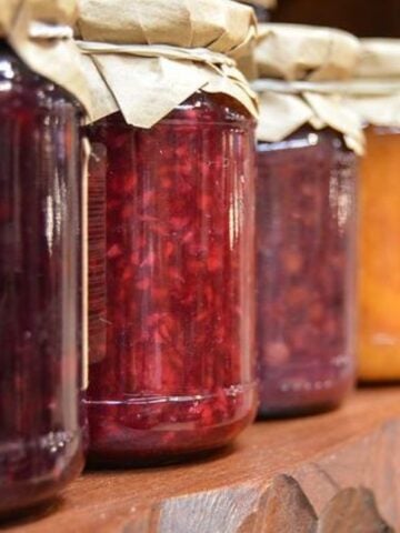 jars of preserved fruit on a shelf.